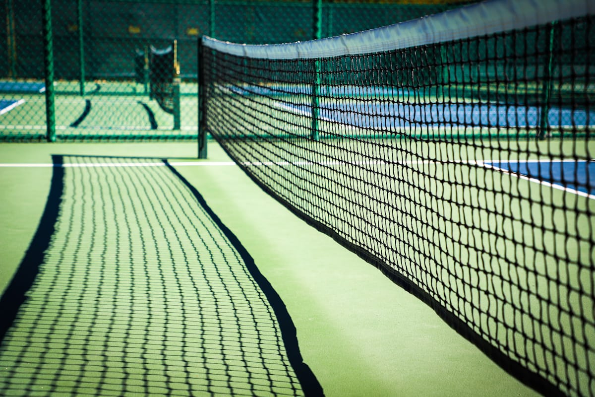 Close-up of a pickleball net at the kitchen line — where control shots live